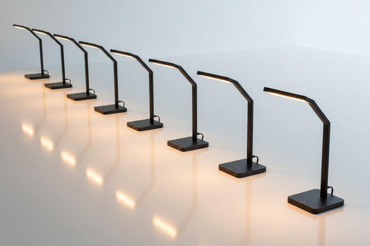 A row of LED desk lamps arranged as year-end corporate gifts for staff and coworkers in a professional office setting